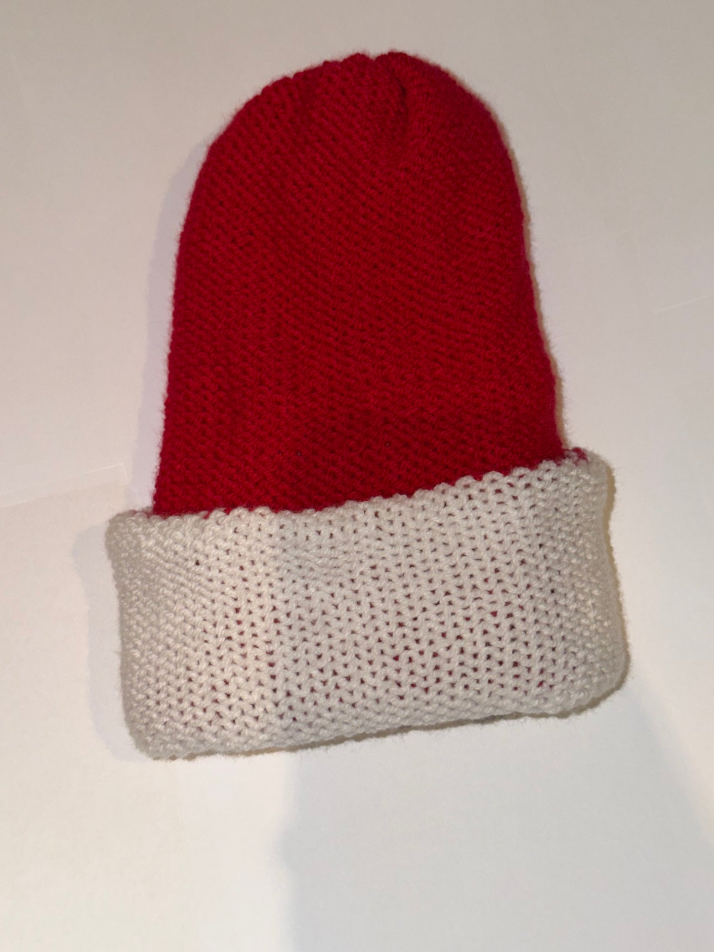 Reversible Christmas Beanie | Handmade Wooly Holiday Hat in vibrant red and white yarn, perfect for festive winter attire.