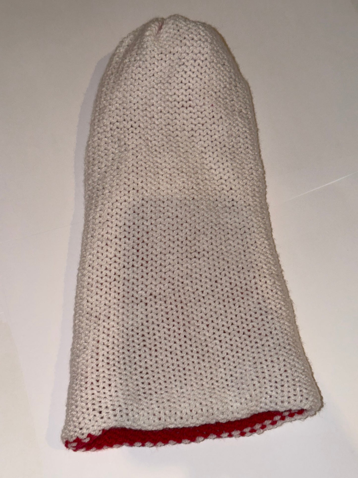 Reversible Christmas Beanie | Handmade Wooly Holiday Hat displayed in white with red lining, showcasing its reversible design.