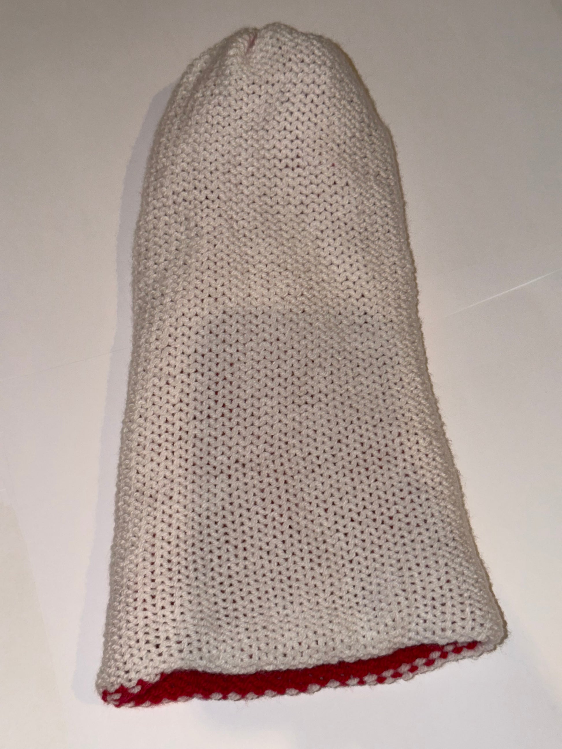 Reversible Christmas Beanie | Handmade Wooly Holiday Hat displayed in white with red lining, showcasing its reversible design.