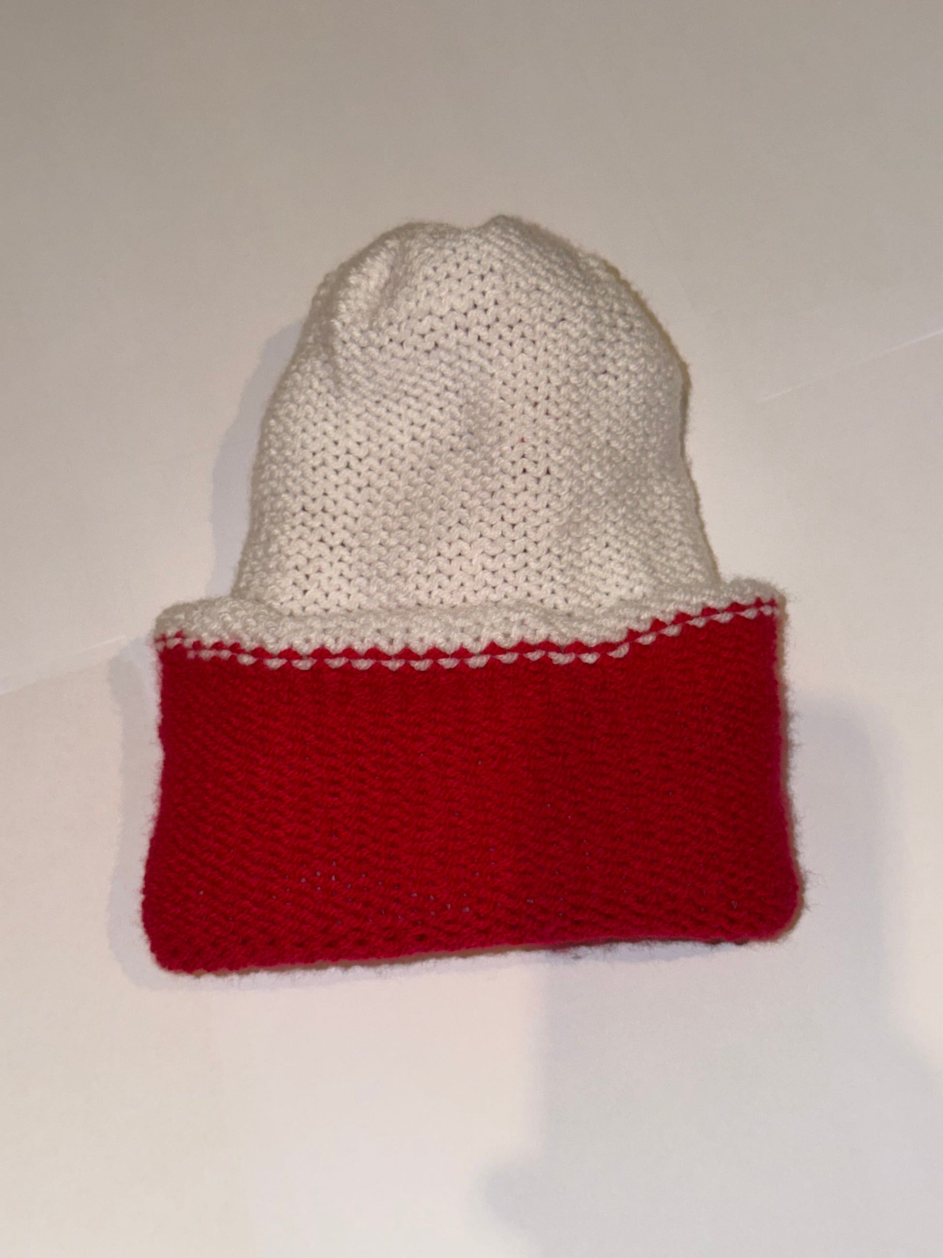 Reversible Christmas Beanie | Handmade Wooly Holiday Hat showcasing a white and red knit design.