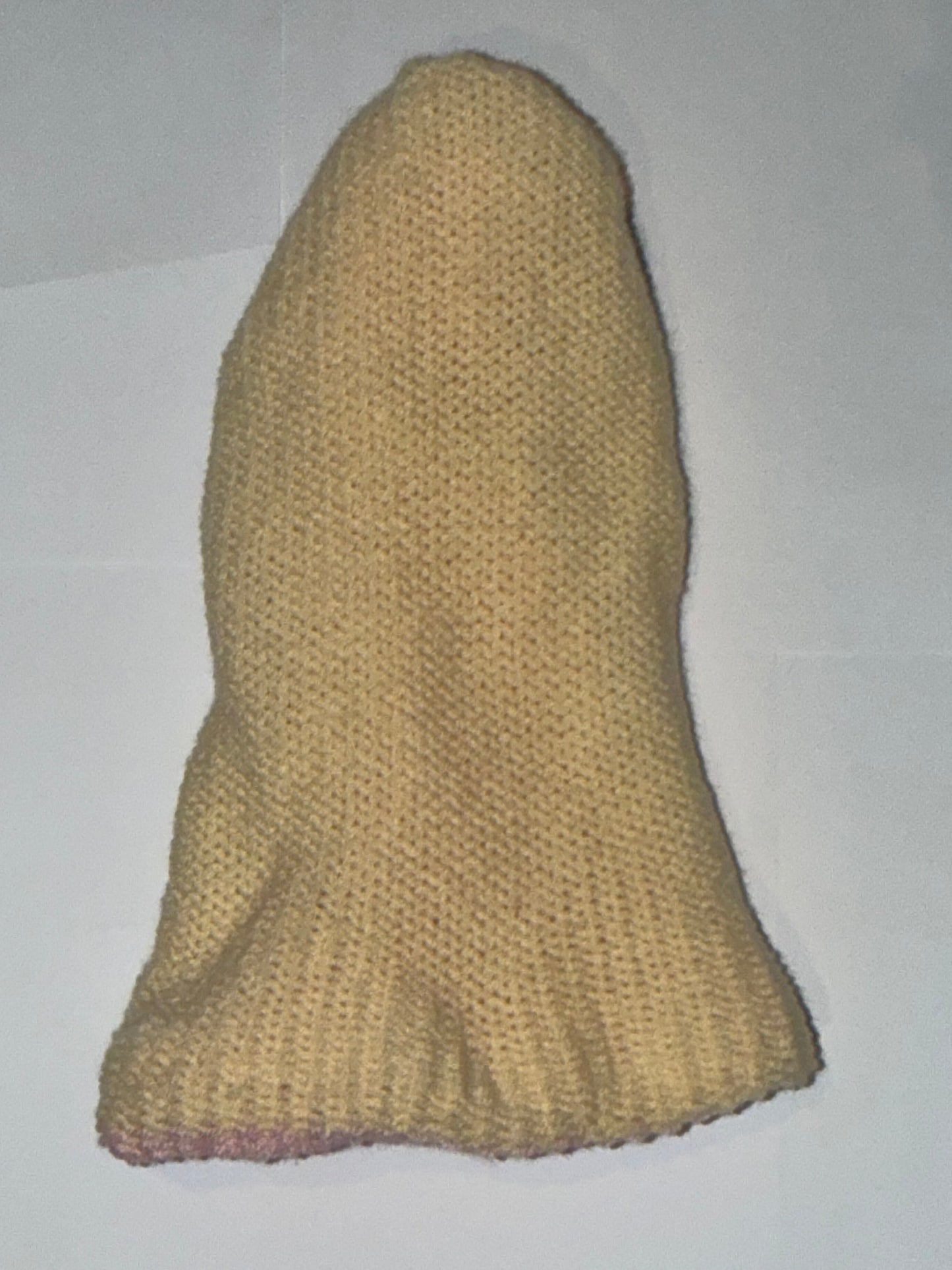 Handmade Reversible Wooly Beanie Light Pink and Cream on a plain background.