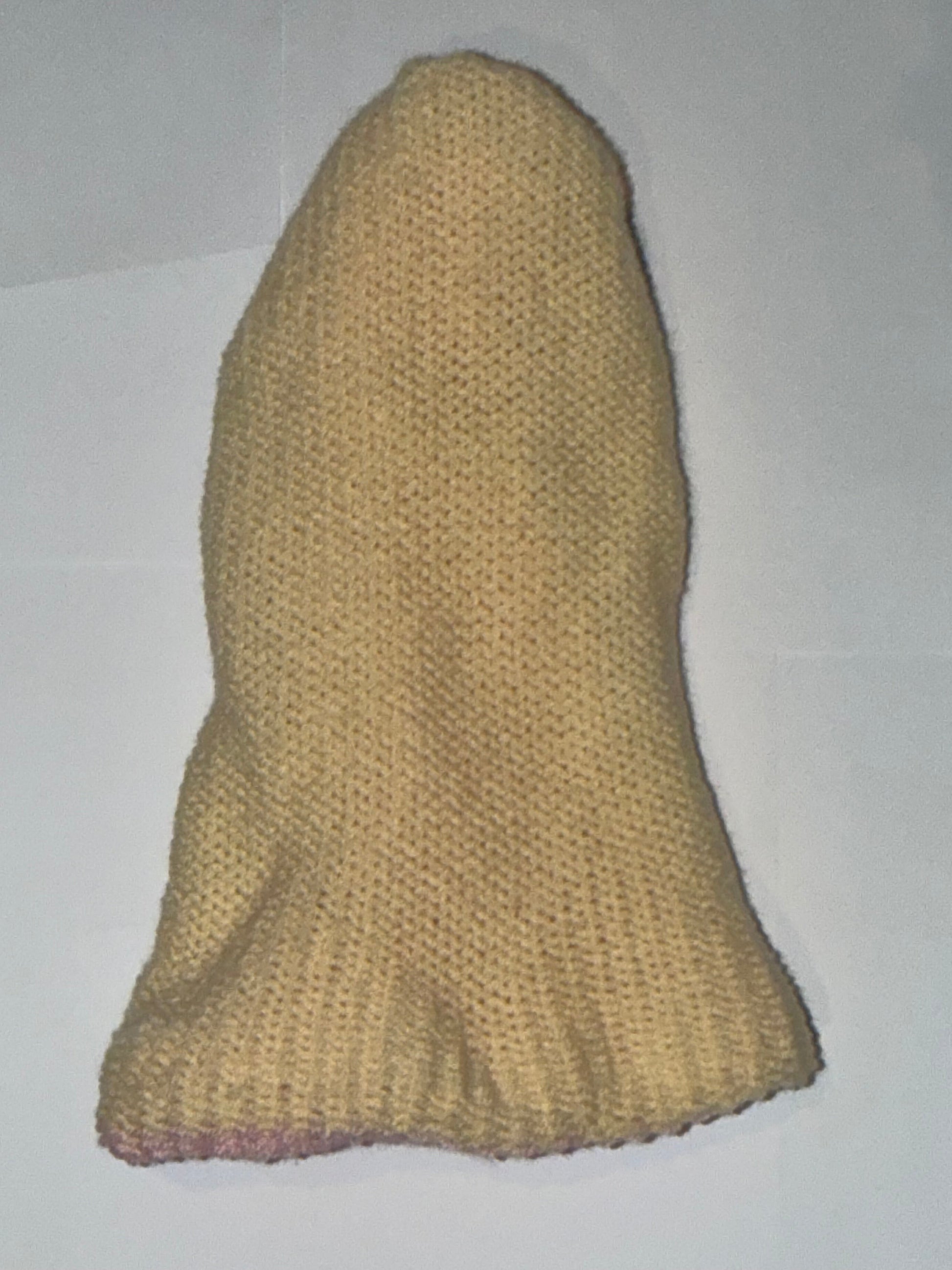 Handmade Reversible Wooly Beanie Light Pink and Cream on a plain background.