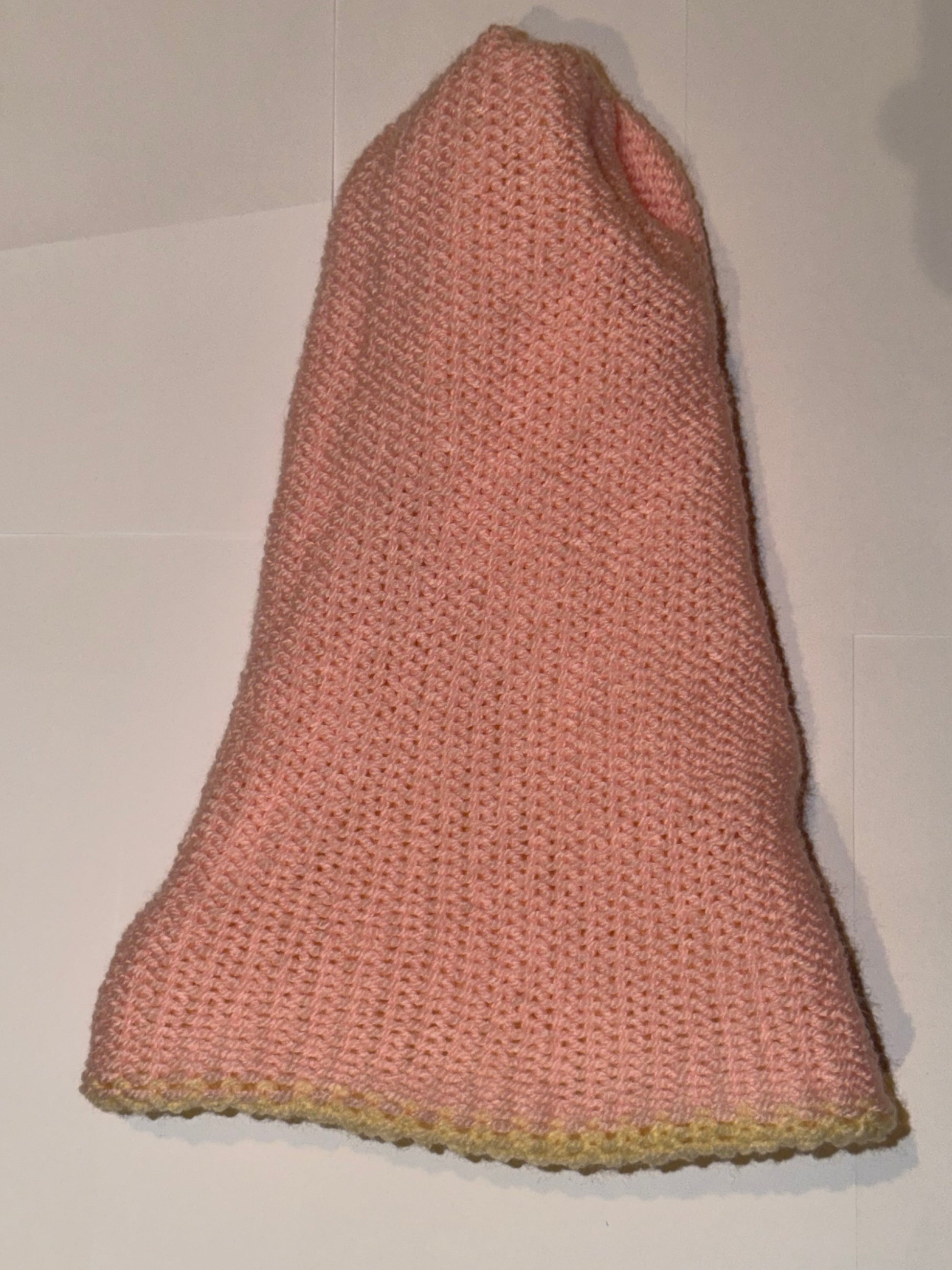 Handmade Reversible Wooly Beanie Light Pink and Cream viewed from the side, showcasing its soft texture.