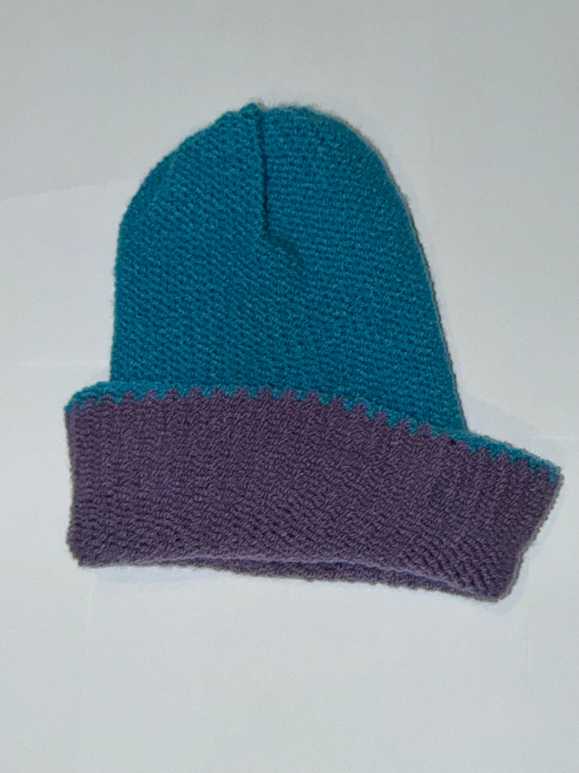 Handmade Reversible Wooly Beanie Dark Lilac and Dark Turquoise showing the rich dual-tone knit.