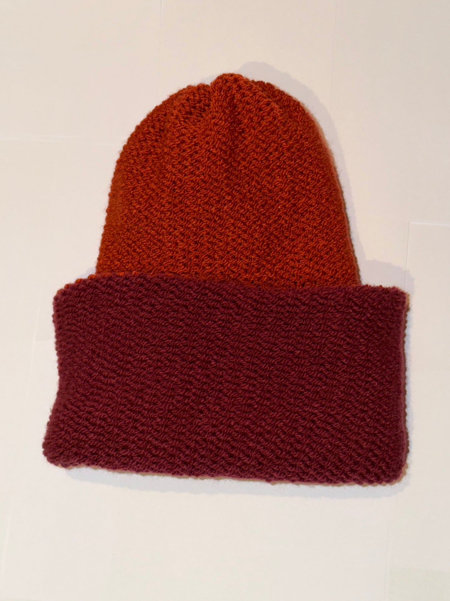 Handmade Reversible Wooly Beanie Plum and Fox Rust showing the autumnal dual-tone knit.