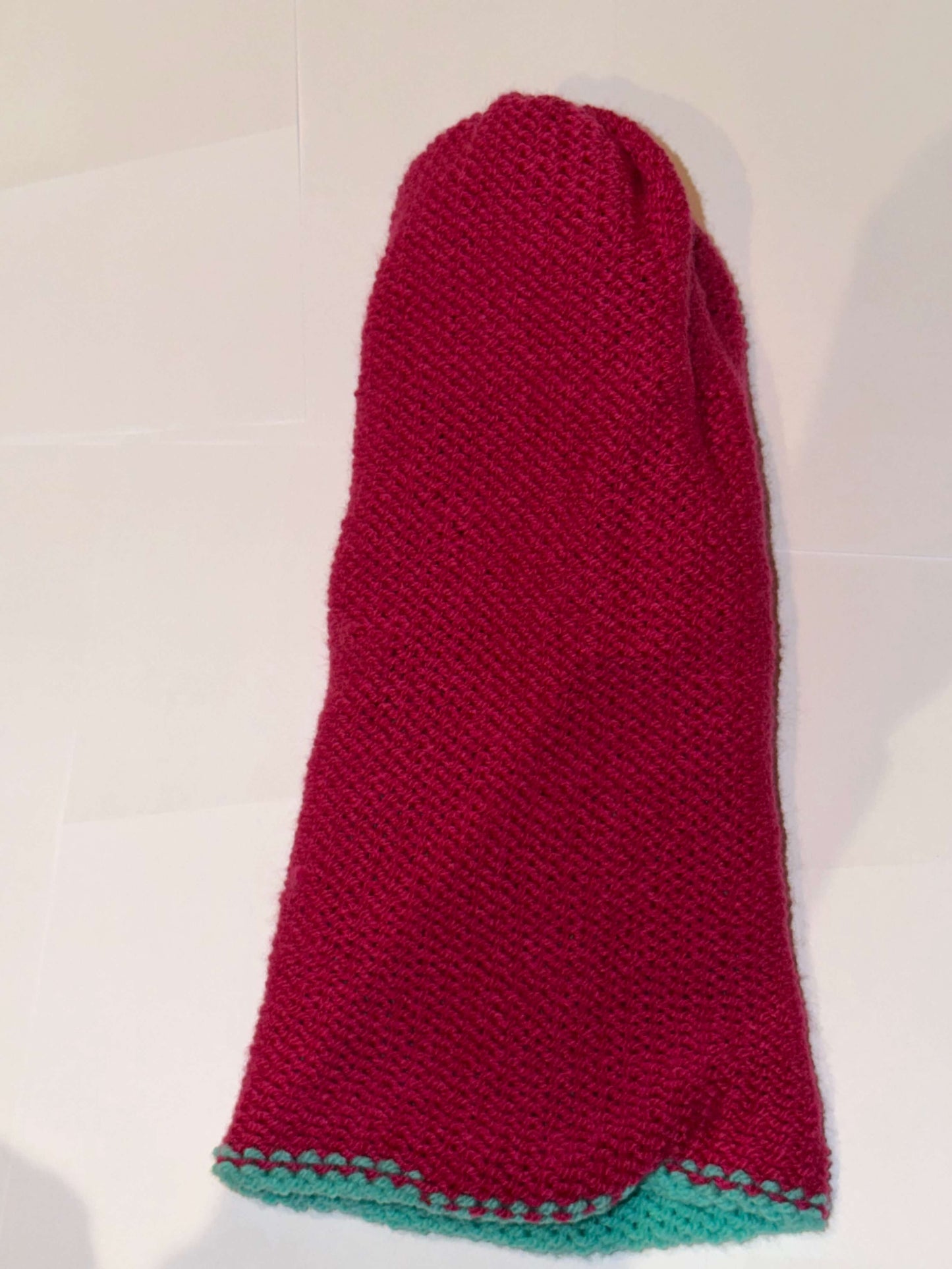 Handmade Reversible Wooly Beanie Aqua and Magenta showing the two-tone artisanal knit design.