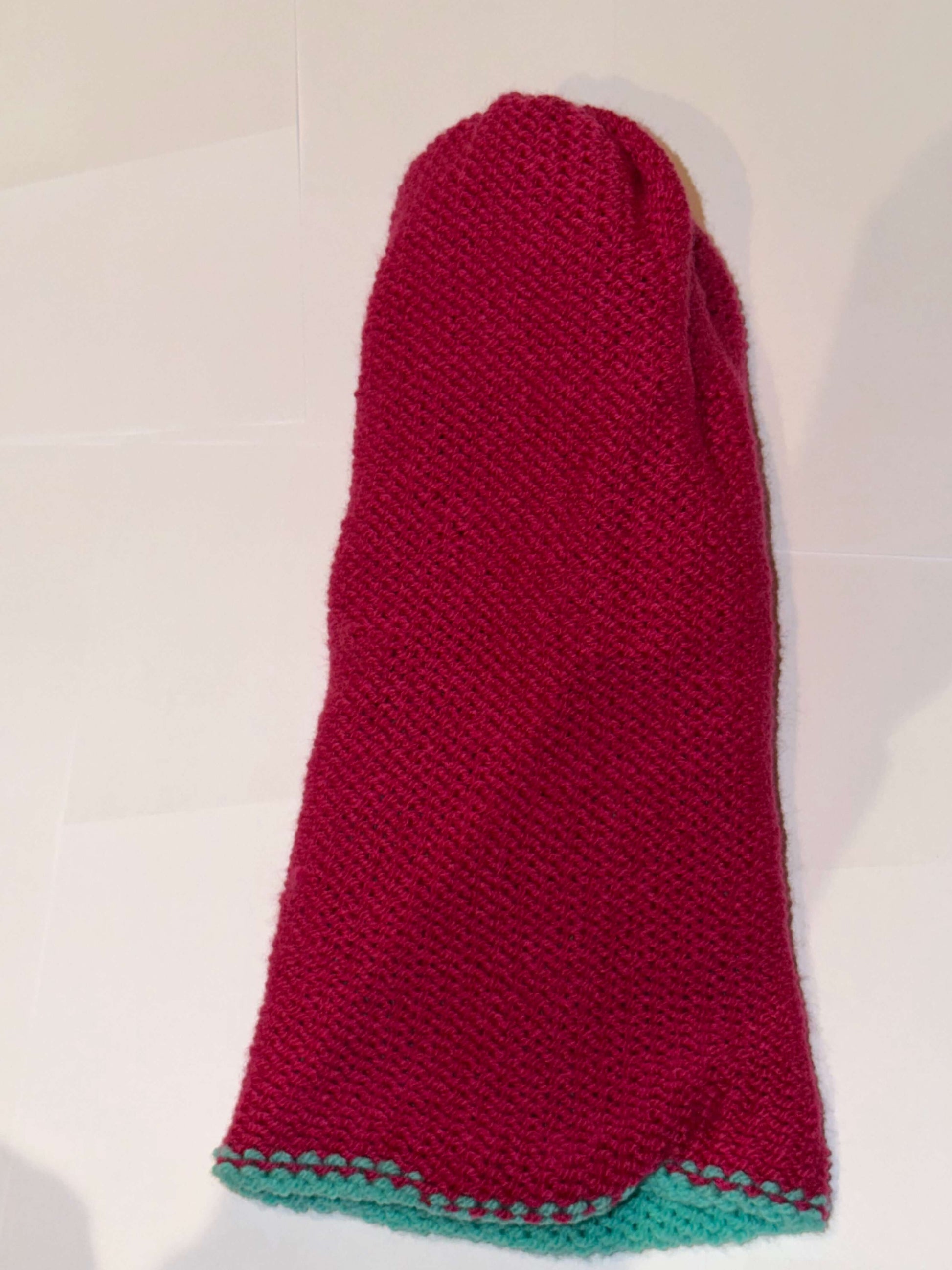 Handmade Reversible Wooly Beanie Aqua and Magenta showing the two-tone artisanal knit design.