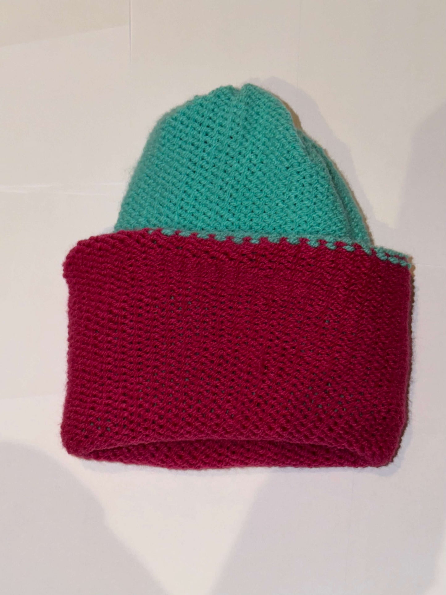 Handmade Reversible Wooly Beanie Aqua and Magenta showing the two-tone artisanal knit design.
