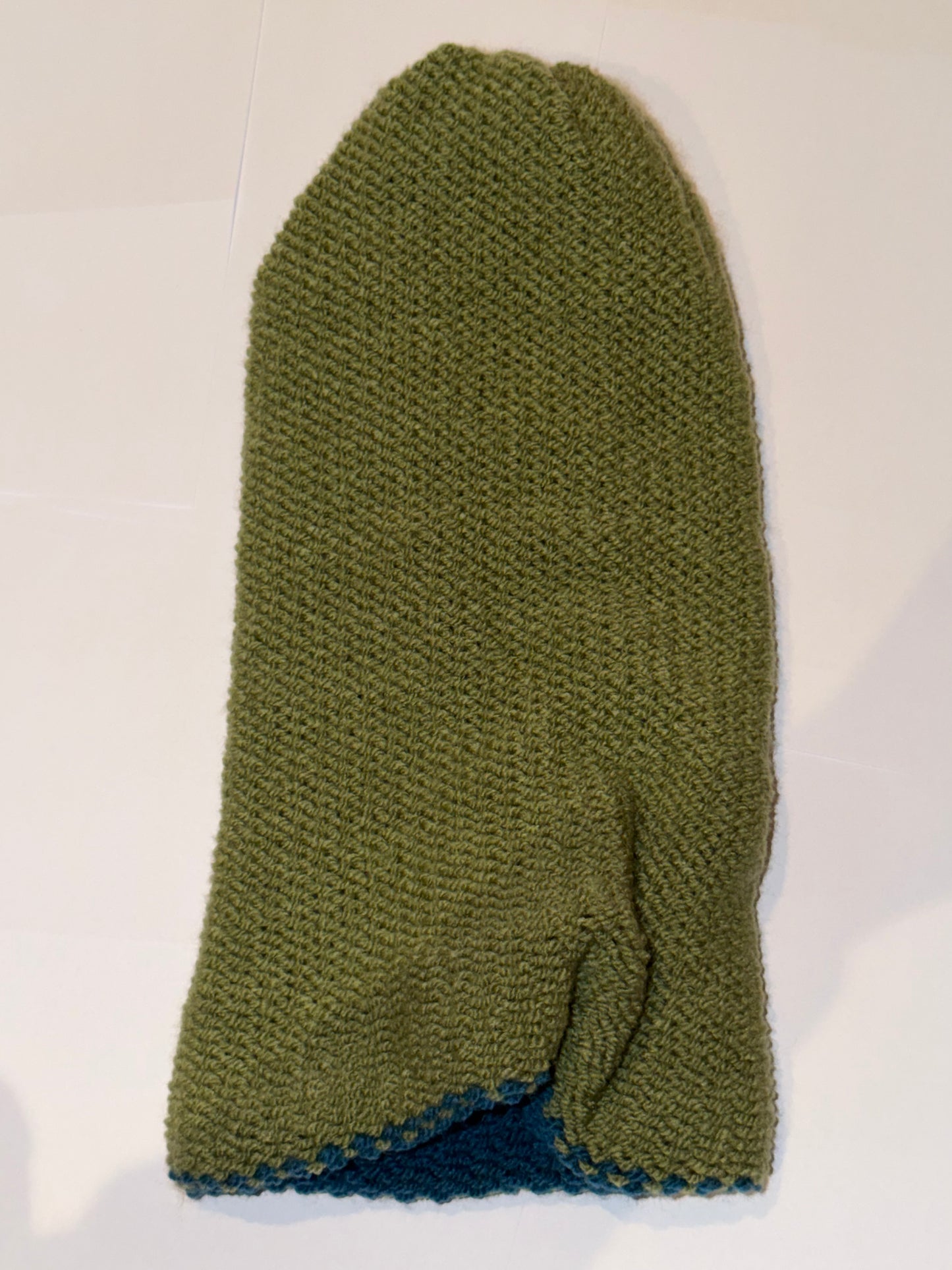 Handmade Reversible Wooly Beanie Petrol and Sage Green showing the earth-toned knit.