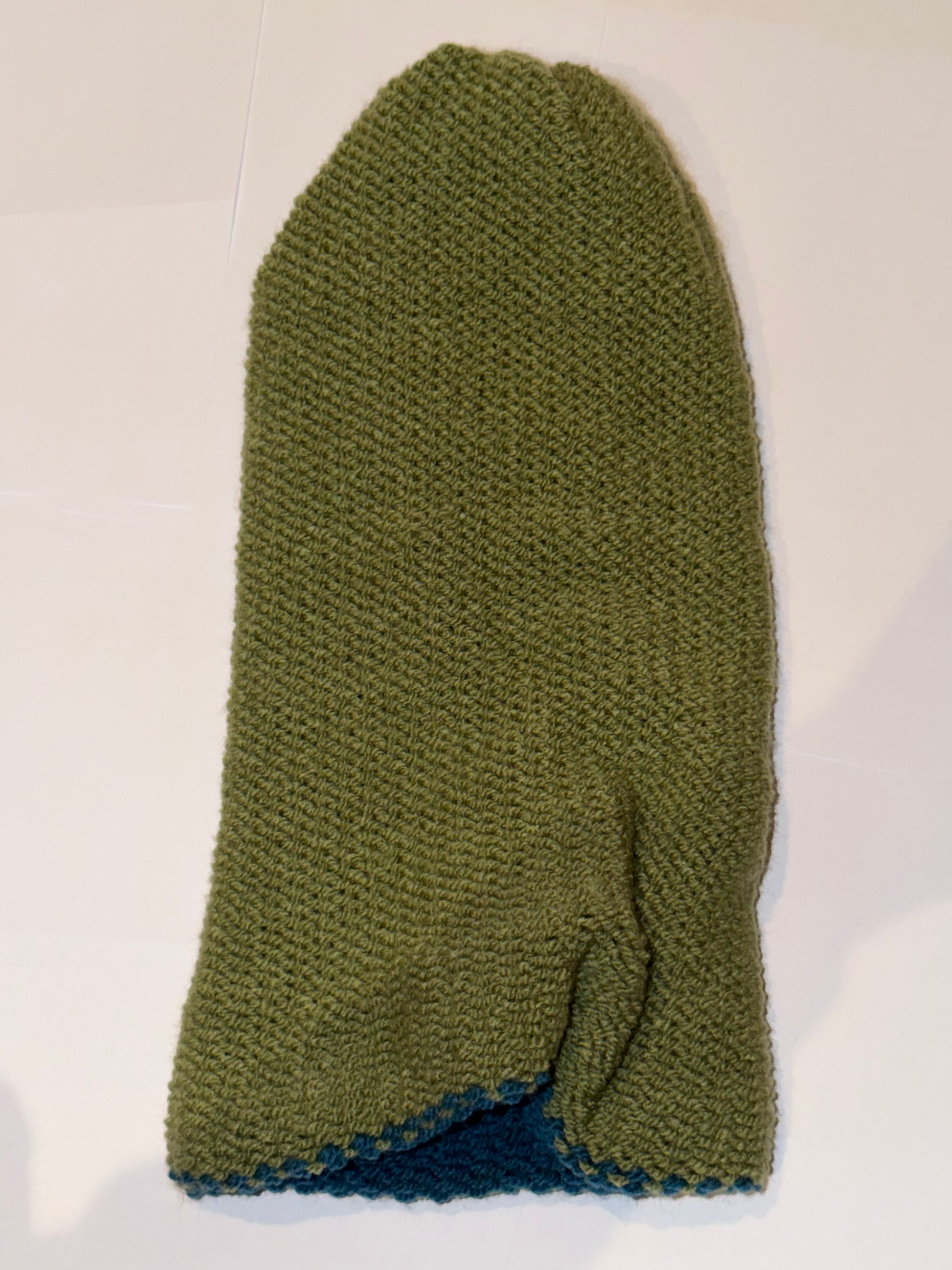 Handmade Reversible Wooly Beanie Petrol and Sage Green showing the earth-toned knit.