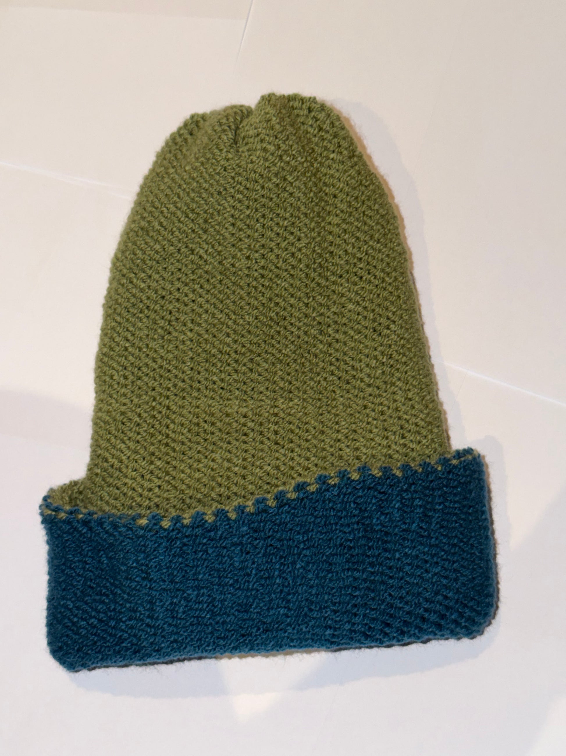 Handmade Reversible Wooly Beanie Petrol and Sage Green showing the earth-toned knit.