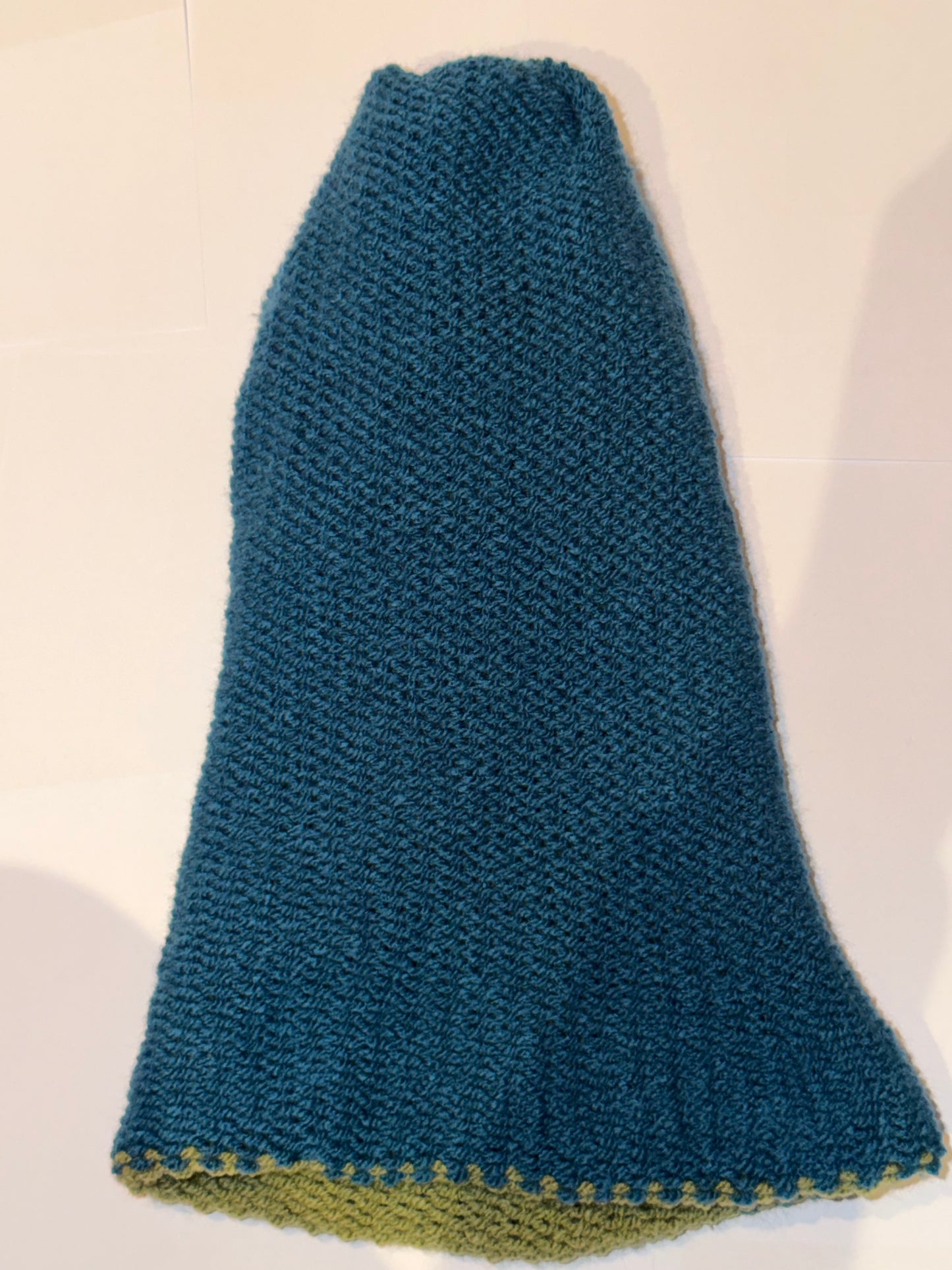 Handmade Reversible Wooly Beanie Petrol and Sage Green showing the earth-toned knit.